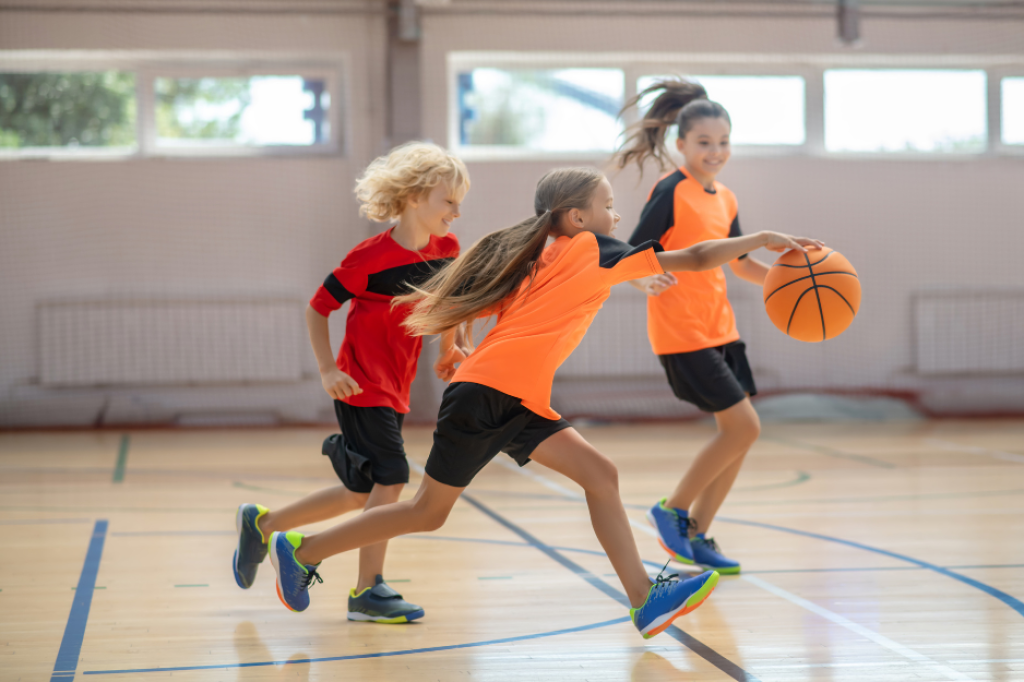Young player dribbling basketball mid-game.