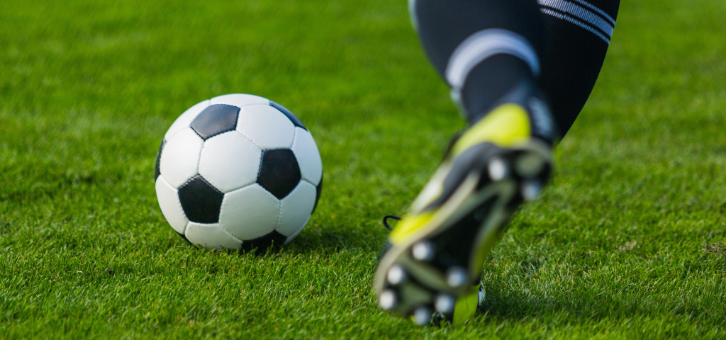 Player about to kick soccer ball.