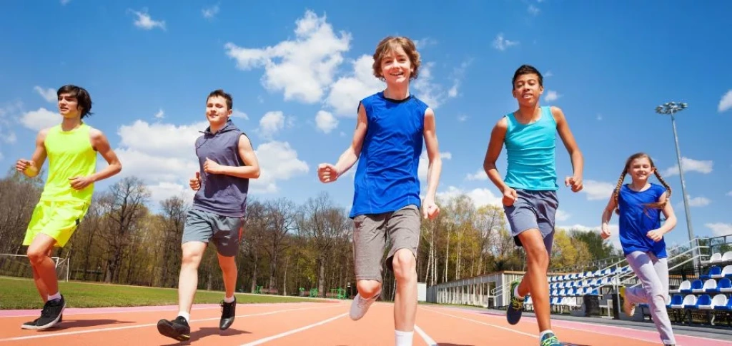 Athletes running on track.