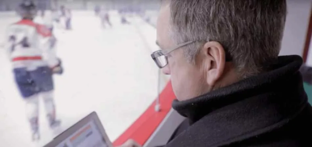 Hockey coaching evaluating players.