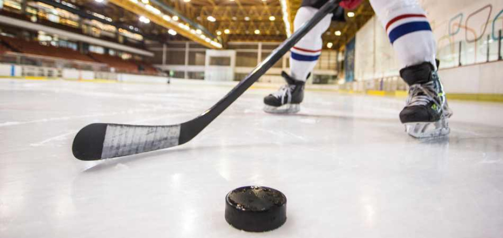 Hockey player with puck.