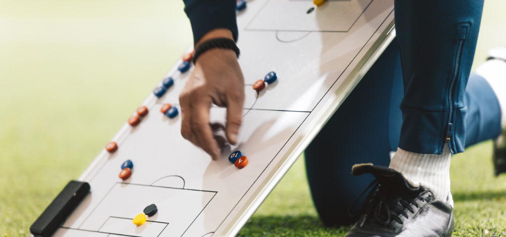 Coaching with clipboard going over strategy.