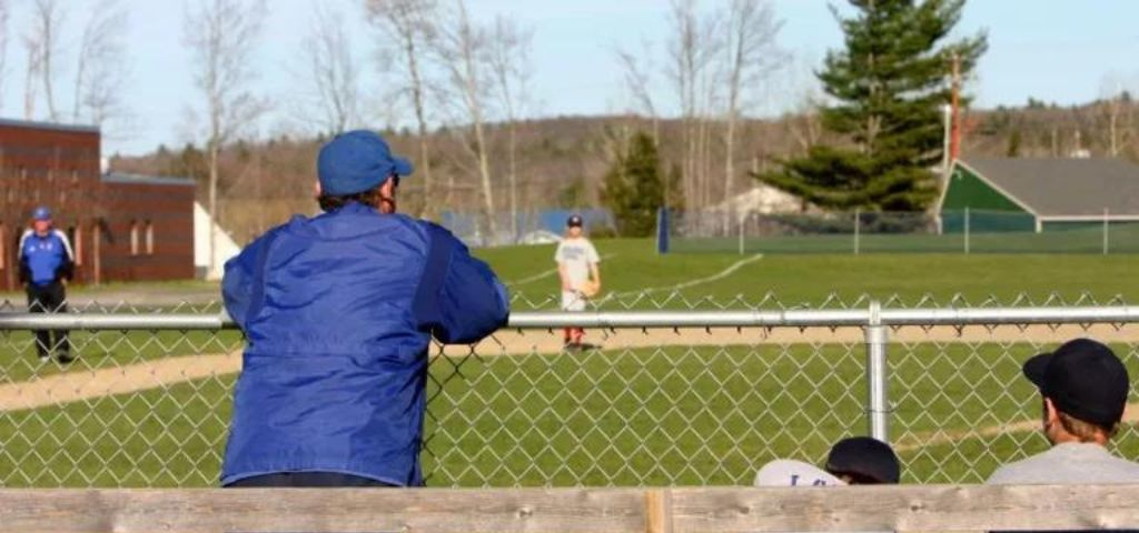 Baseball coach looking out onto field.