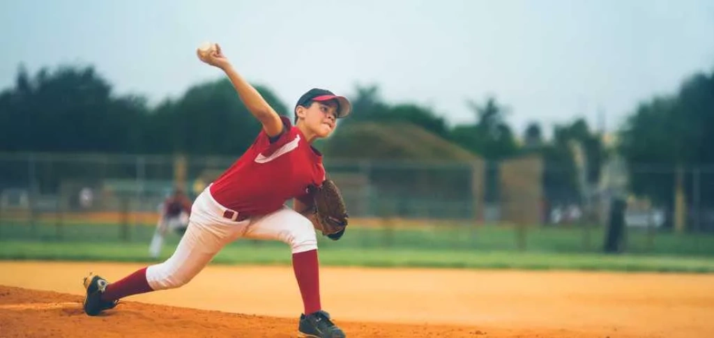 Baseball player throwing ball.
