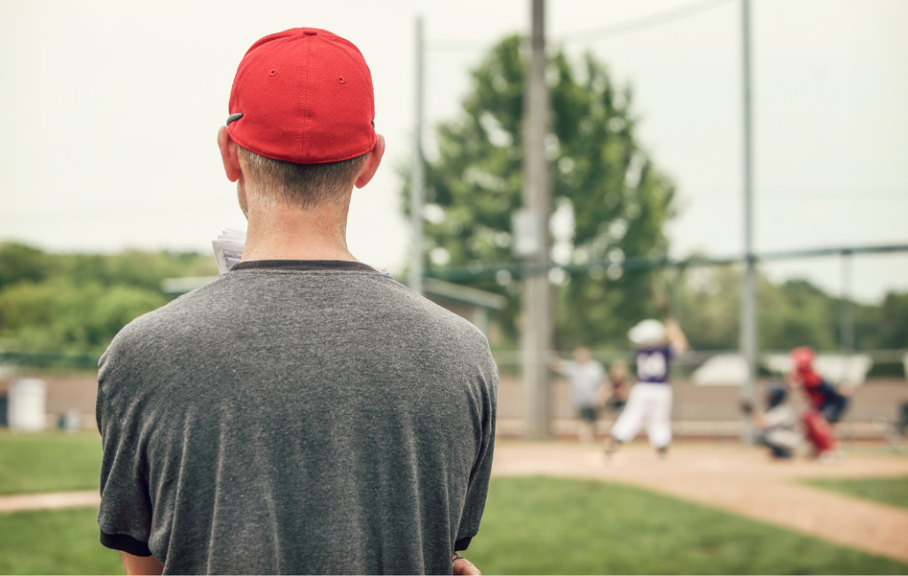 Baseball coach looking out onto field.