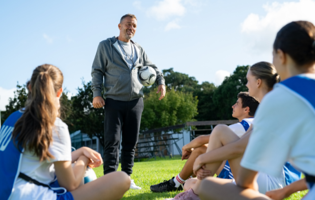 Coach giving soccer players advice.