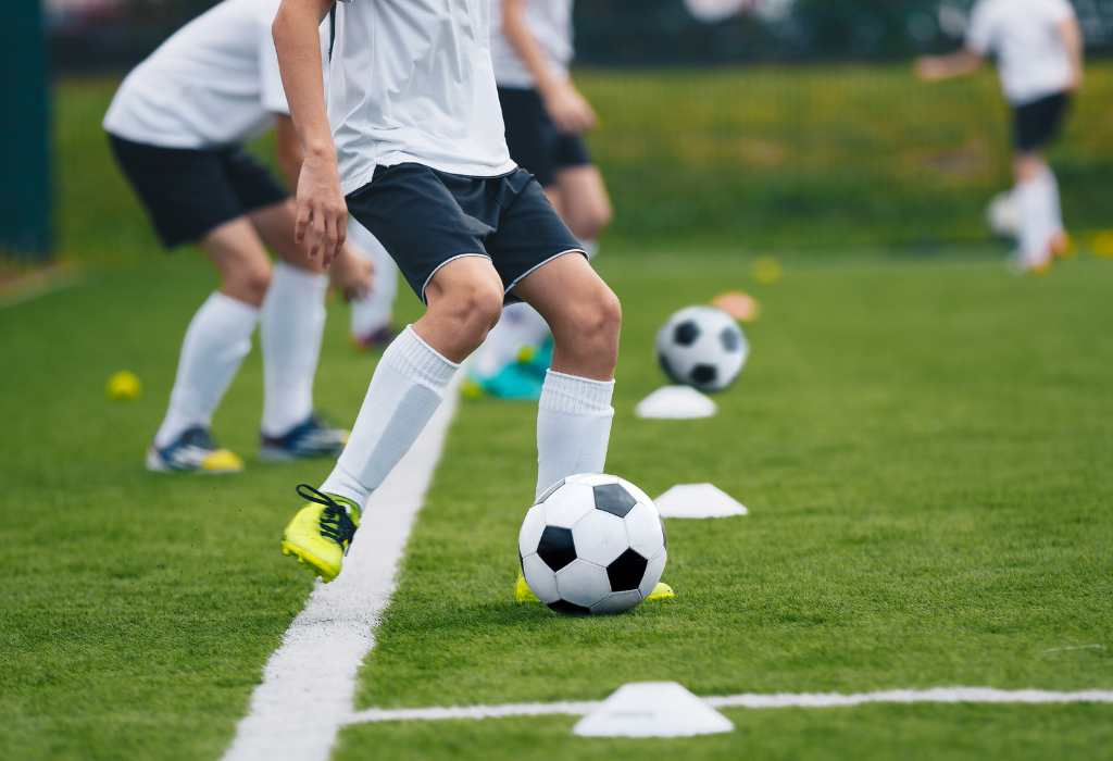 Player about to kick soccer ball.