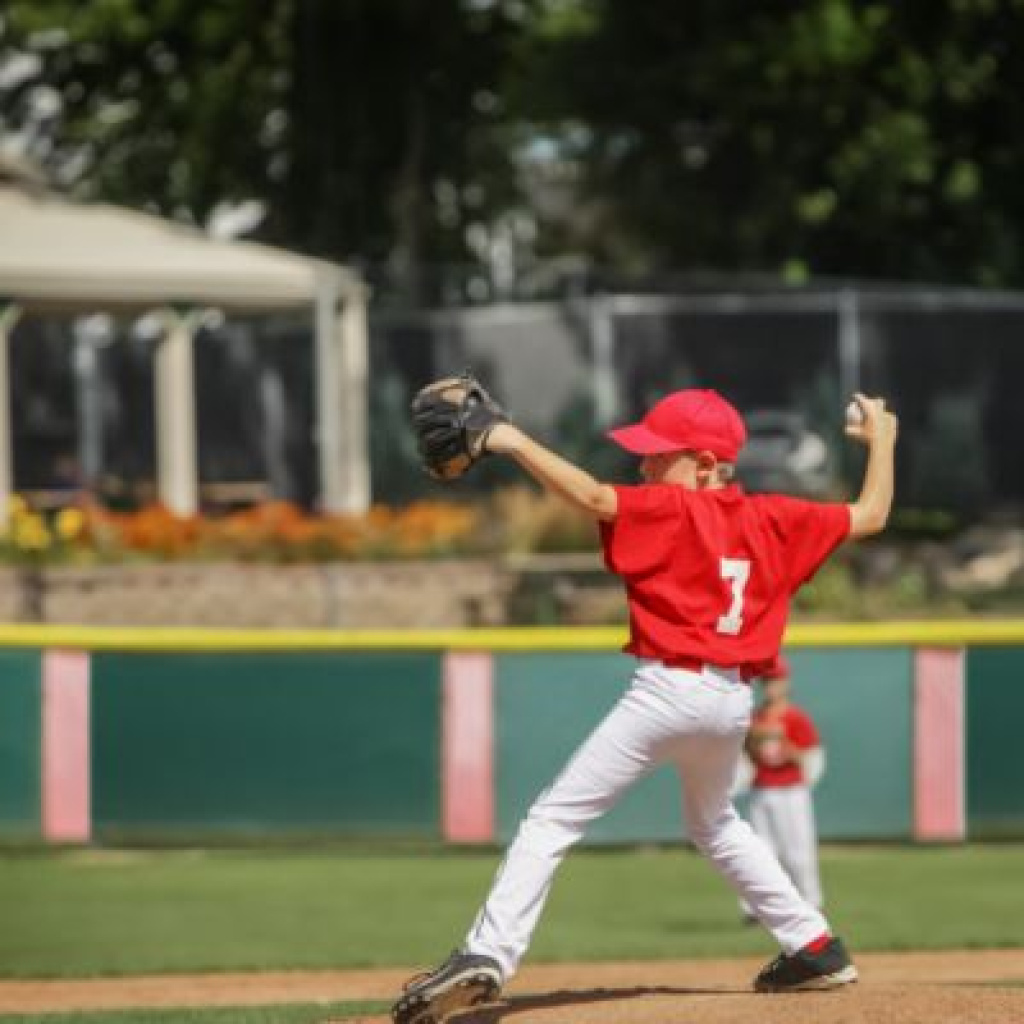 Baseball player about to make a throw.