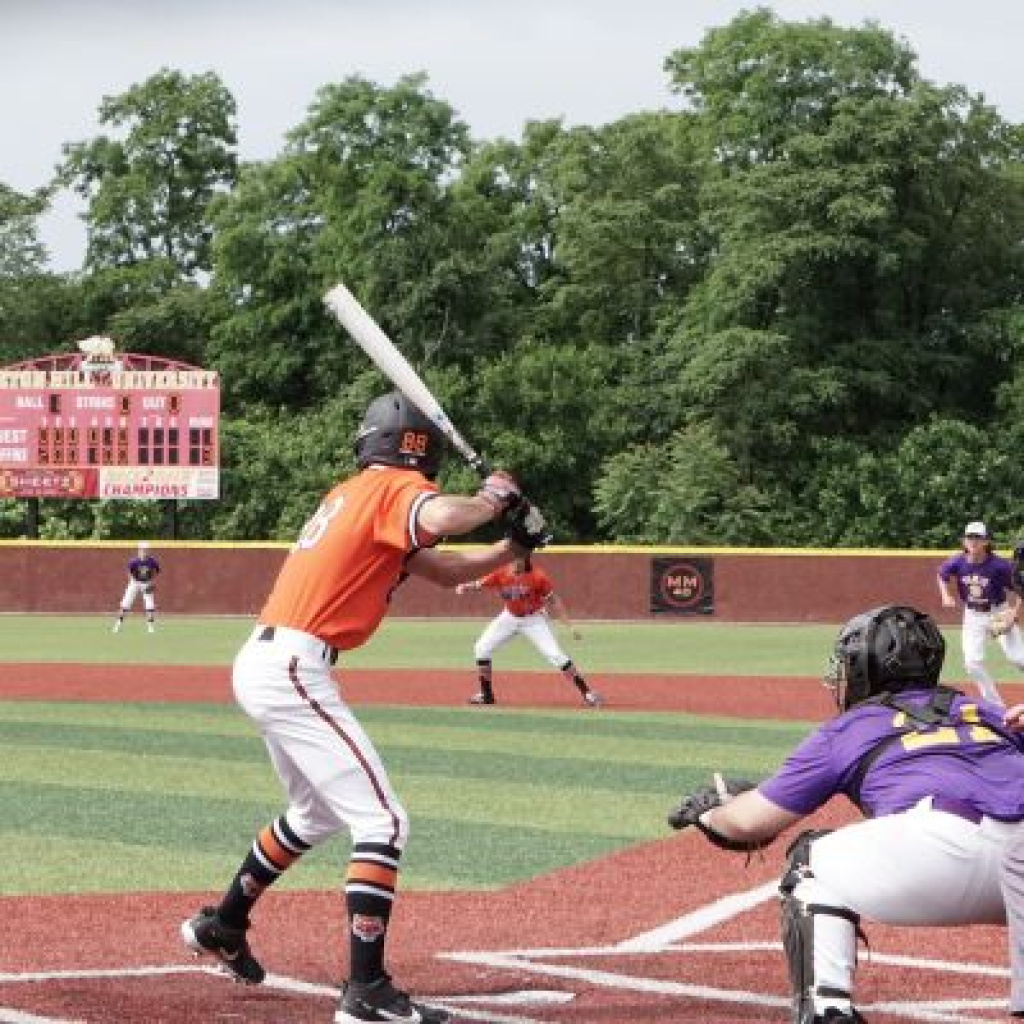 Baseball player ready in swing stance.