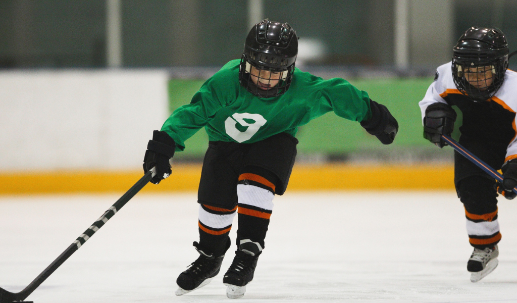 Hockey player with possession of puck.