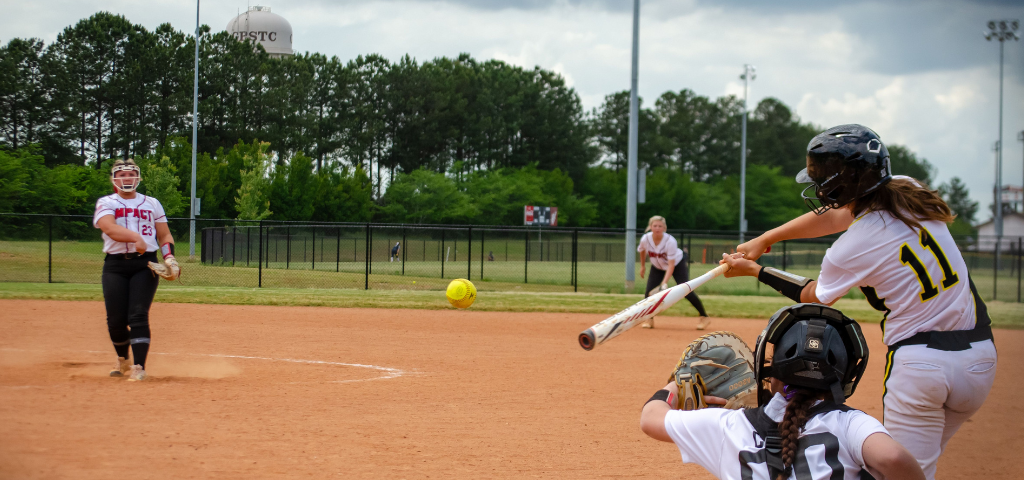 Softball player up to bat.