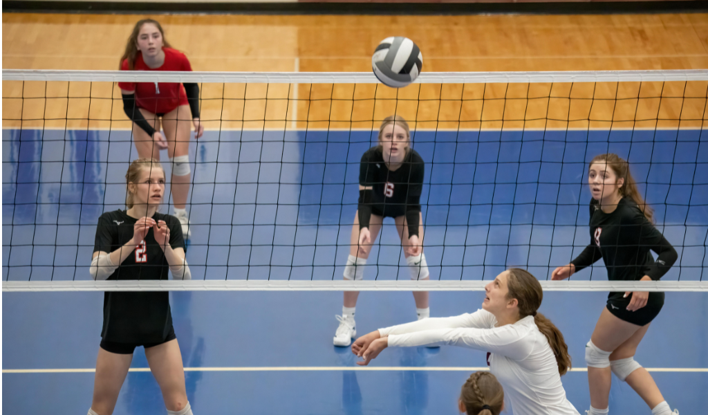 Player about to bump volleyball.