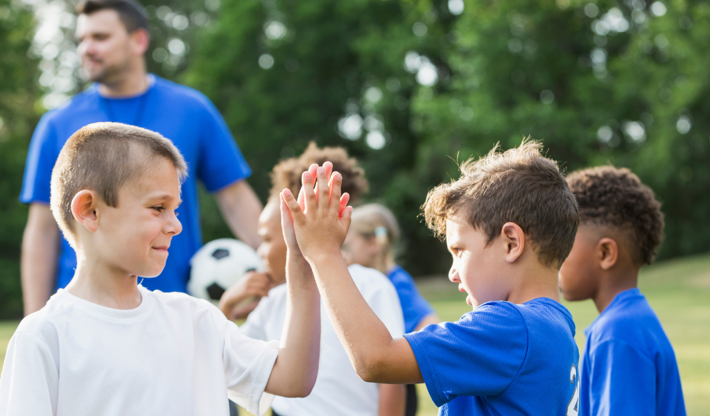 Young athletes exhibiting sportsmanship